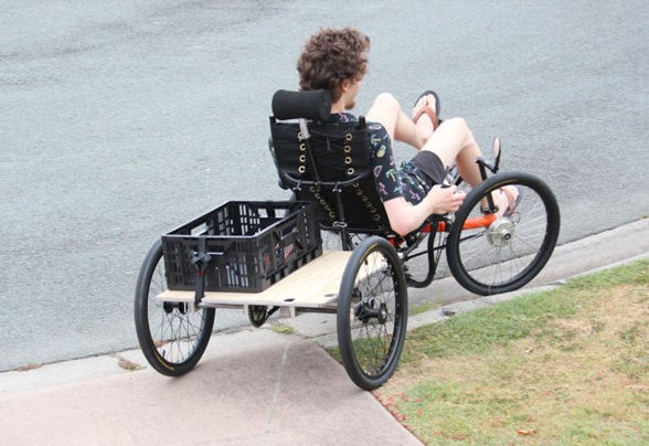 Recumbent Cargo quad riding overr a kerb