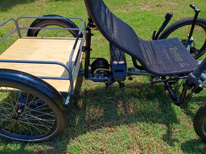 Recumbent cargo quad cycle, view of battery mounted under seat