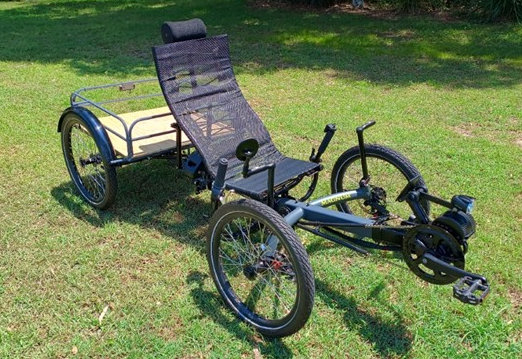 Recumbent cargo quad cycle viewed from front left